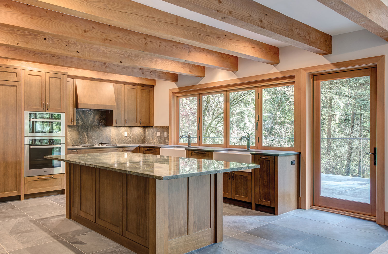 Beautiful kitchen with wood windows, door, and mouldings