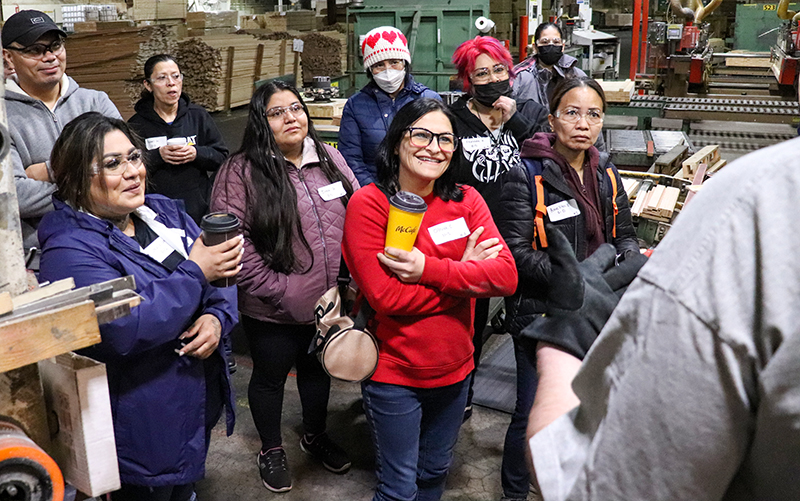 Bright Wood people interested in becoming moulder operators listen to an introduction by a longtime operator