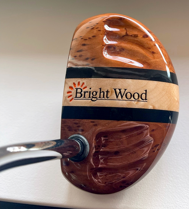 Custom-carved wooden putter