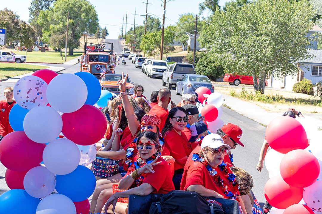 Parade float view with red and white balloons